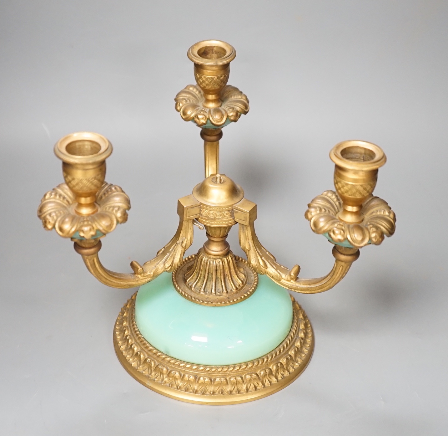 A three branch porcelain and ormolu mounted candelabrum, 19.5cm high